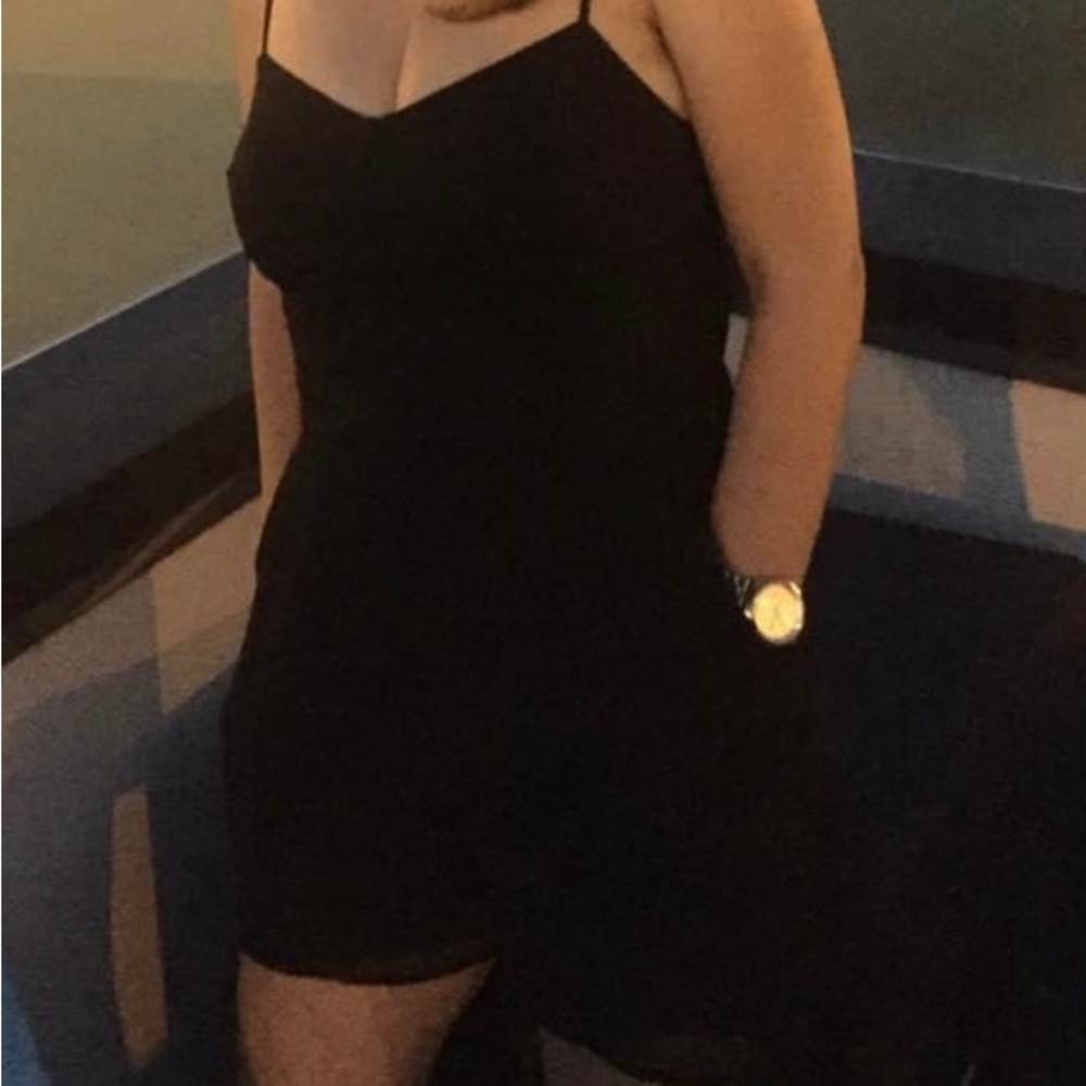 Bebe black shirts romper with zipper, pockets and side cutouts